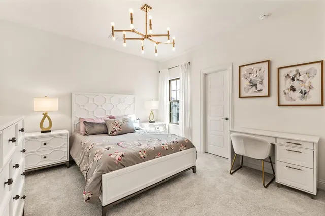 a bedroom with a bed and cabinets