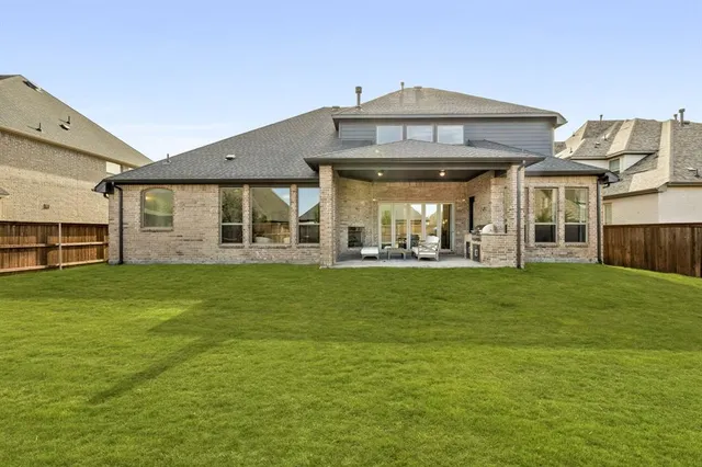 a view of a big house with a big yard