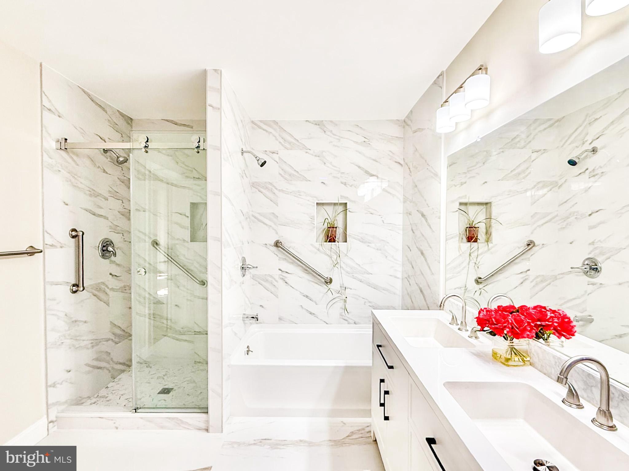 7 C Rutland Lane Monroe Township, NJ 08831 - Photo 15 of 41 a bathroom with a sink vanity mirror and shower