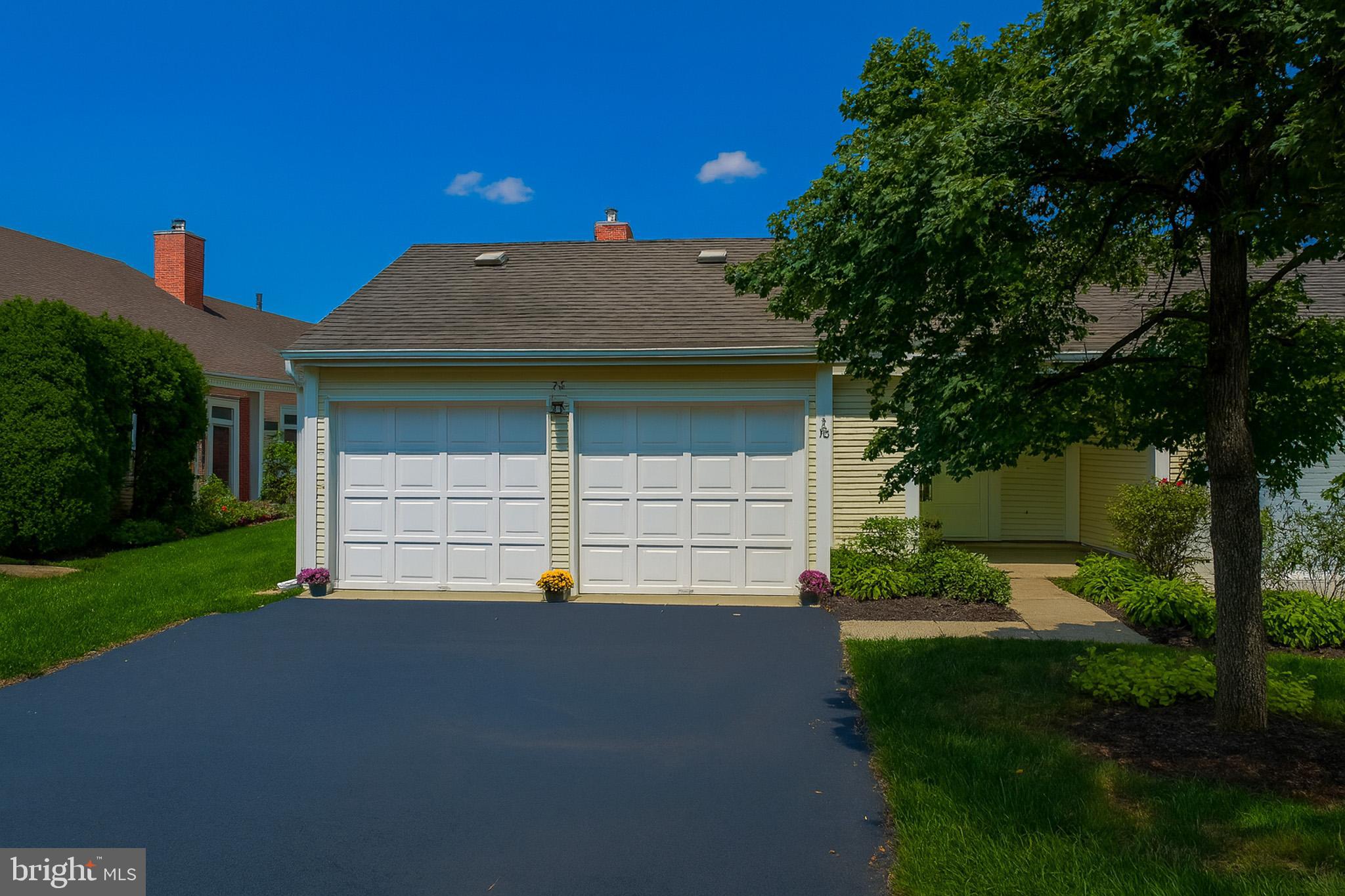 7 C Rutland Lane Monroe Township, NJ 08831 - Photo 3 of 41 a view of a house with a yard and garage