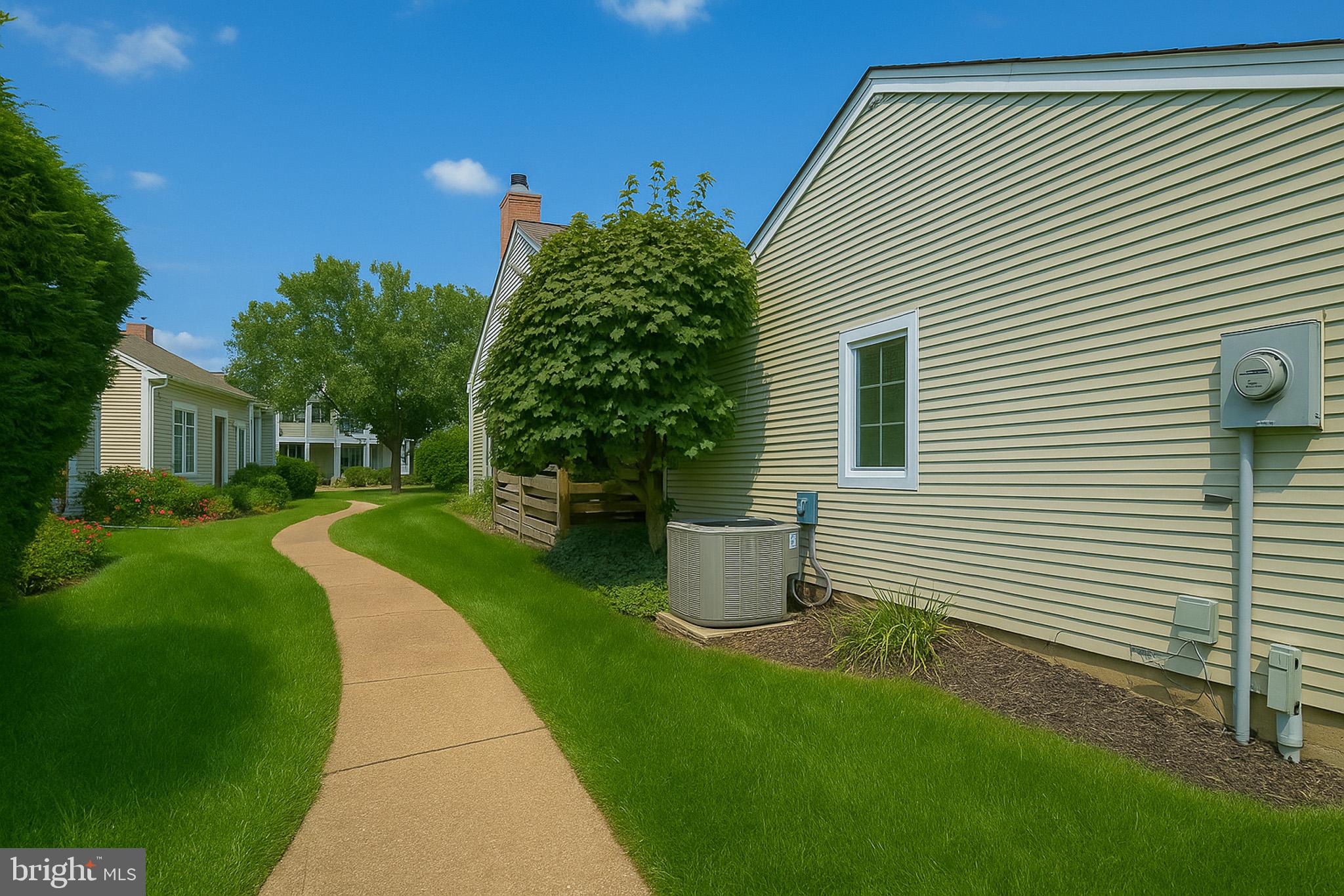7 C Rutland Lane Monroe Township, NJ 08831 - Photo 40 of 41 a house view with a garden space