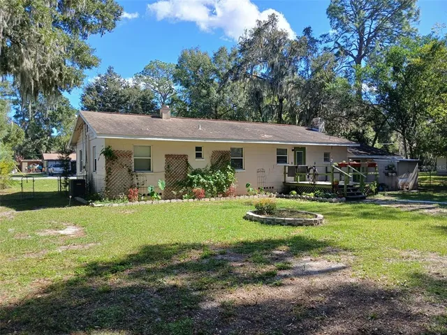 a front view of a house with garden and porch
