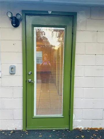 a view of a house with yard and a tree