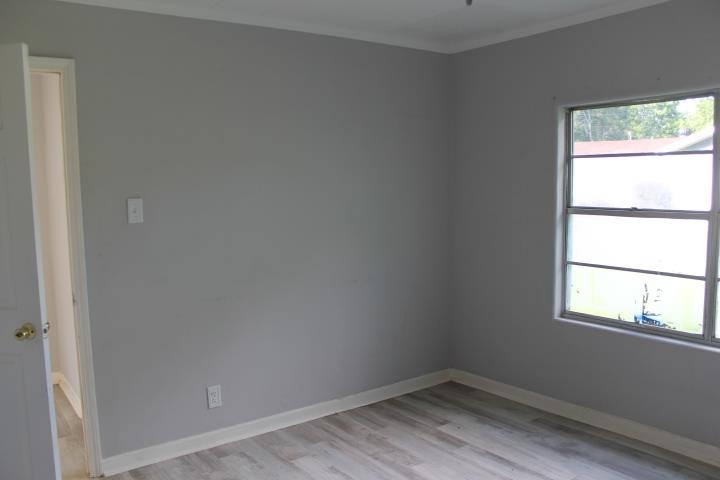875 Woodrow Street Silsbee, TX 77656 - Photo 28 of 30 an empty room with a window