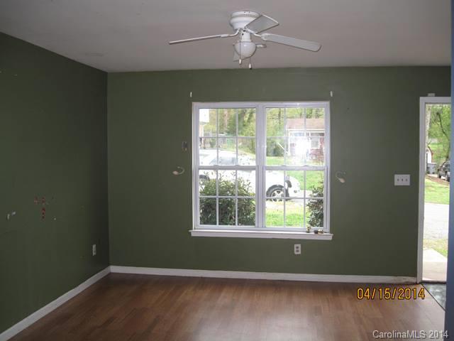 356 Sleepy Hollow Road Charlotte, NC 28217 - Photo 2 of 6 a view of room with window ceiling fan and hardwood floor