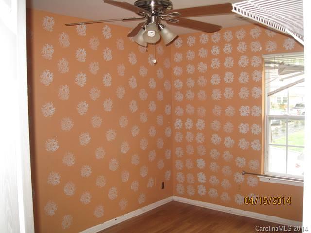 356 Sleepy Hollow Road Charlotte, NC 28217 - Photo 5 of 6 a view of empty room with wooden floor and fan