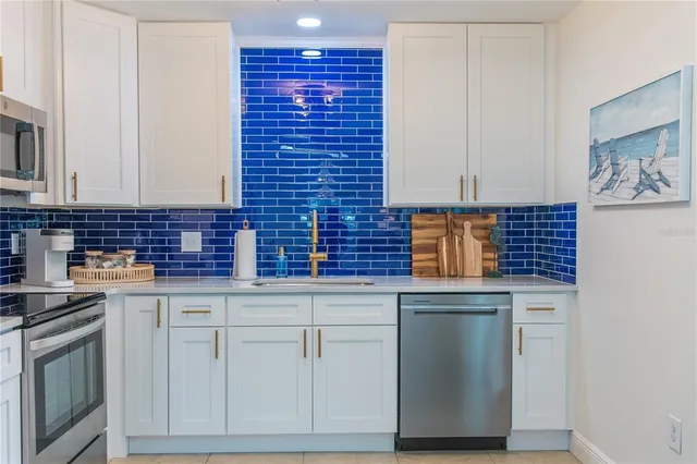 a bathroom with a granite countertop sink mirror and shower