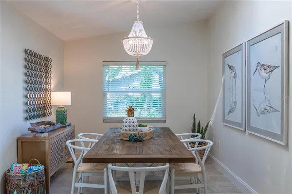 a view of a dining room with furniture window and outside view