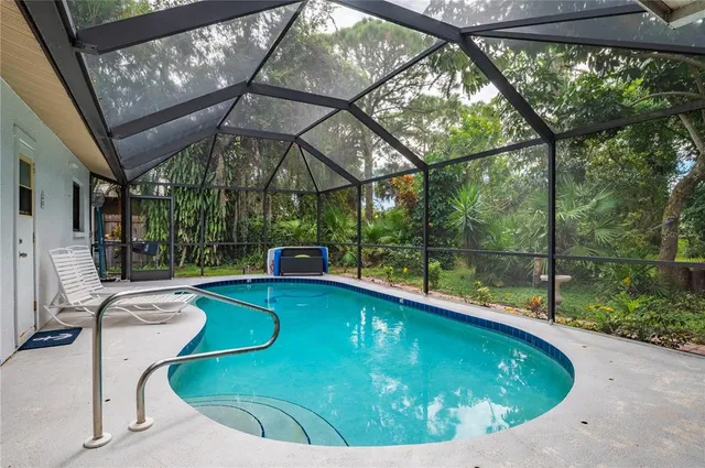 a view of a swimming pool with a patio