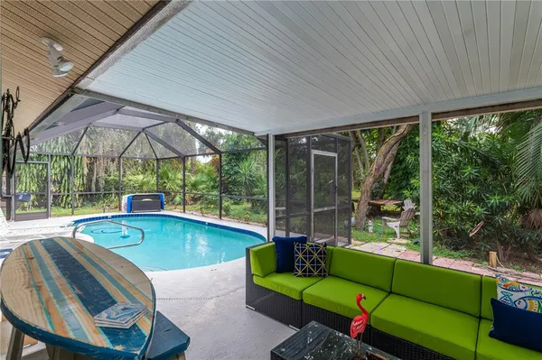 a view of a chairs and table in the patio