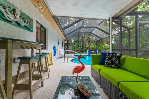 a backyard of a house with outdoor seating