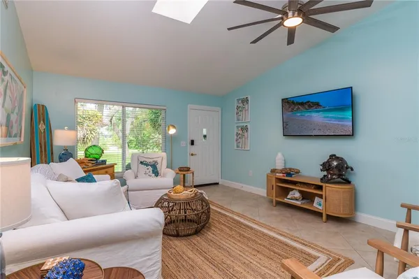 a living room with furniture and a large window