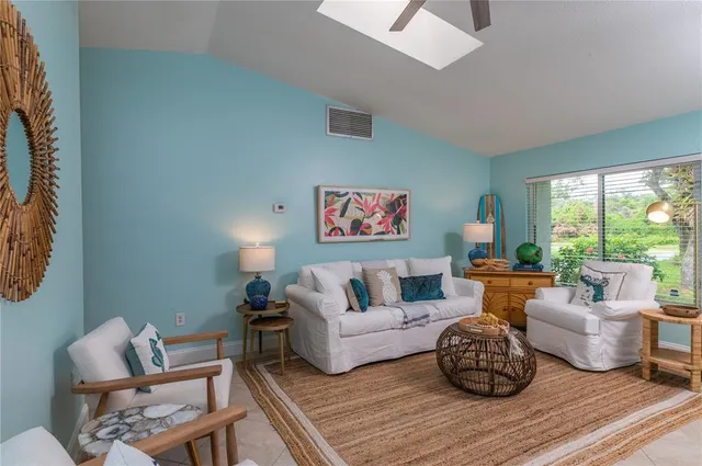 a kitchen with stainless steel appliances a stove a sink a refrigerator and a refrigerator