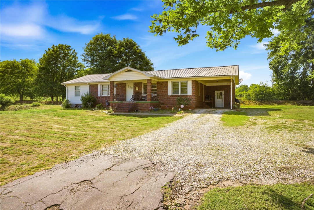 282 West Bennett Road Westminster, SC 29693 - Photo 33 of 42 This charming home offers a spacious yard and inviting front porch, perfect for outdoor enjoyment.