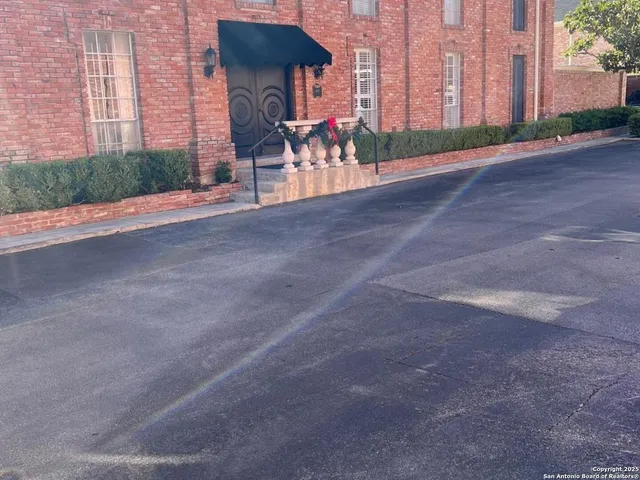 a view of a building with a street