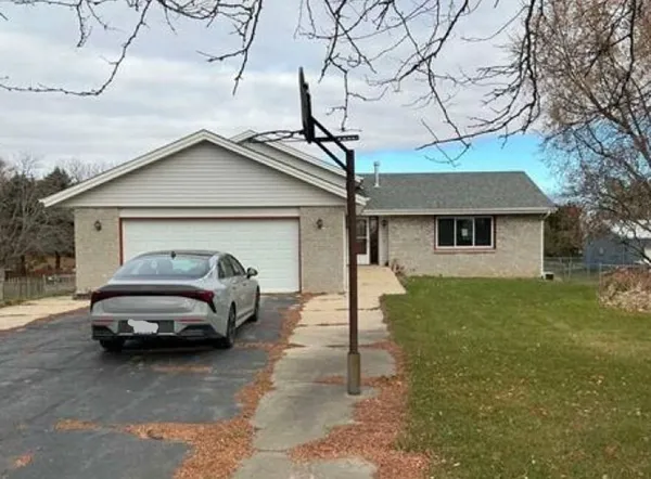 a car parked in front of a house