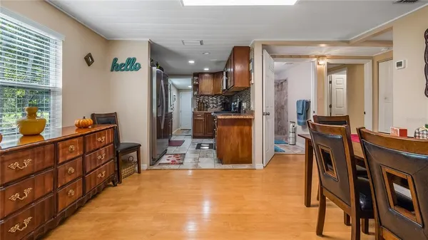 a view of kitchen with furniture and refrigerator