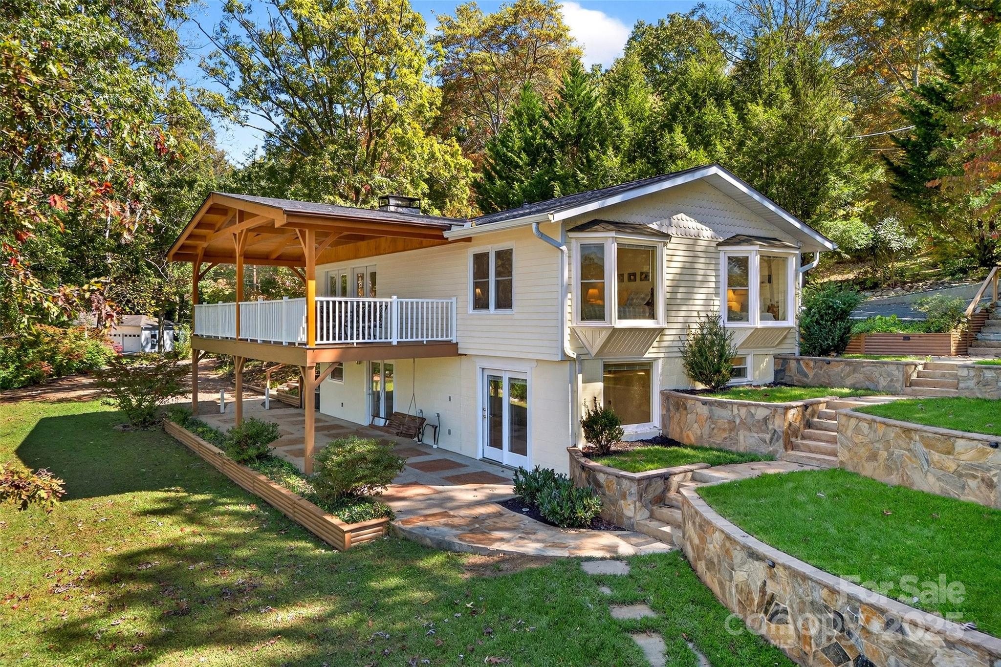 211 Rhododendron Avenue Black Mountain, NC 28711 - Photo 1 of 48 a front view of house with yard and green space