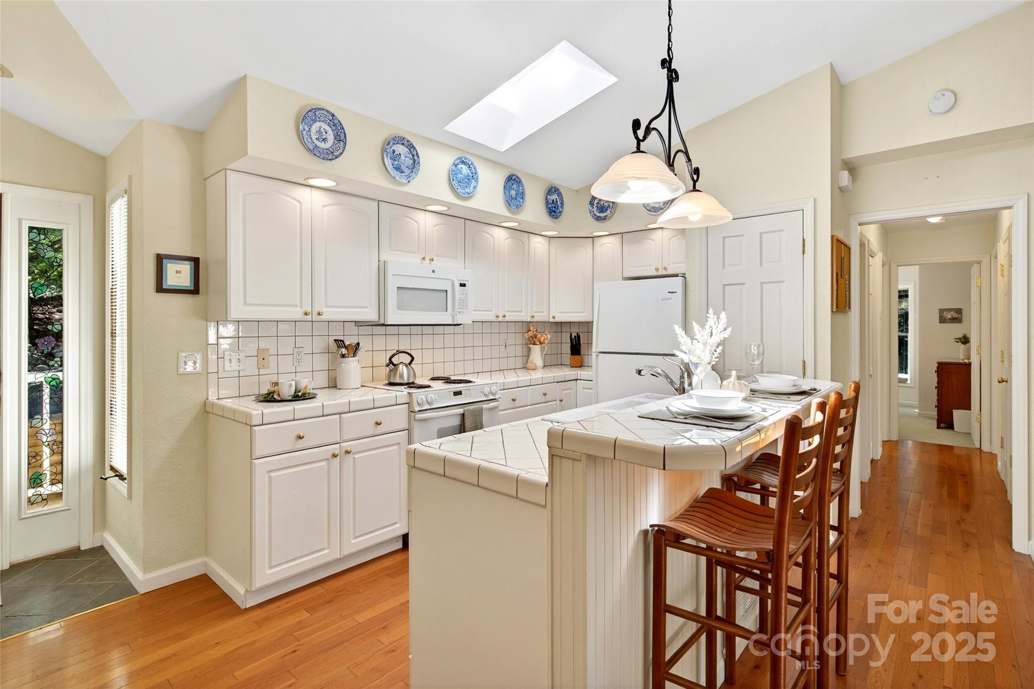 211 Rhododendron Avenue Black Mountain, NC 28711 - Photo 15 of 48 a kitchen with a sink and cabinets