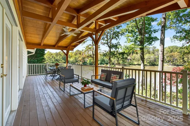 a view of a chairs and table in patio with wooden floor