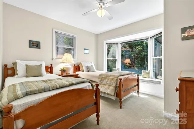 a bed room with a bed and a chandelier