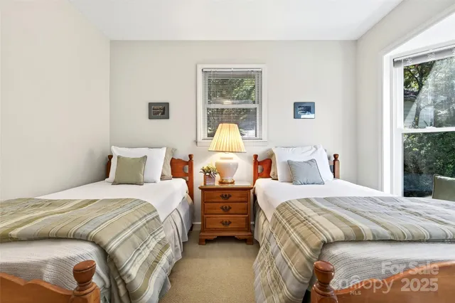 a bedroom with bed and window