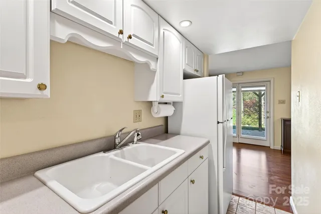 a bathroom with a sink a mirror and a bathtub