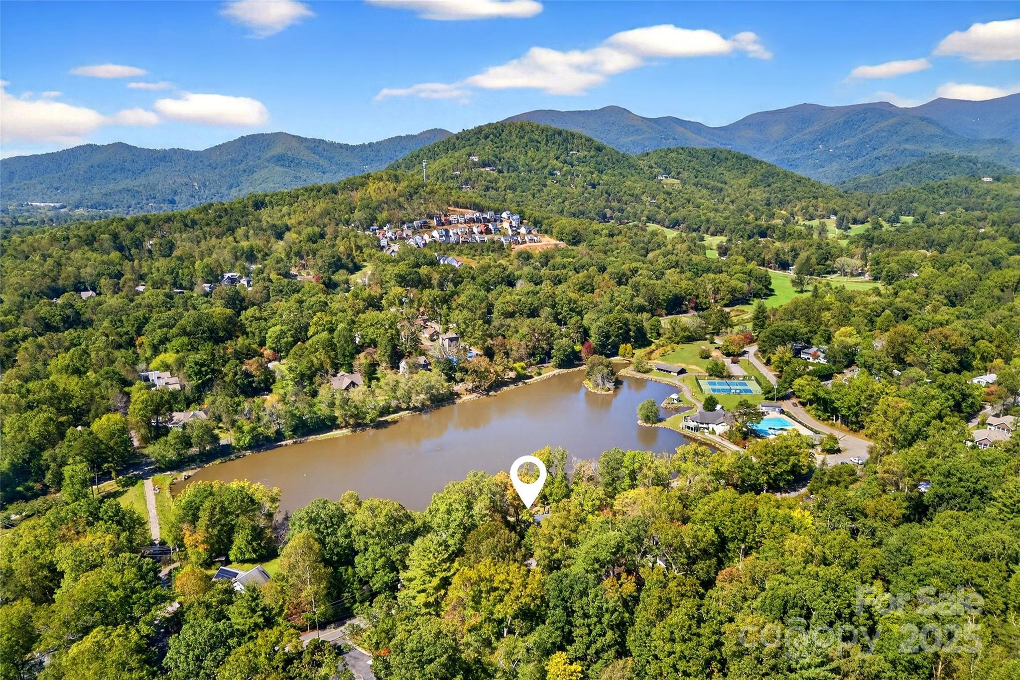 211 Rhododendron Avenue Black Mountain, NC 28711 - Photo 40 of 48 a view of a city with mountains in the background