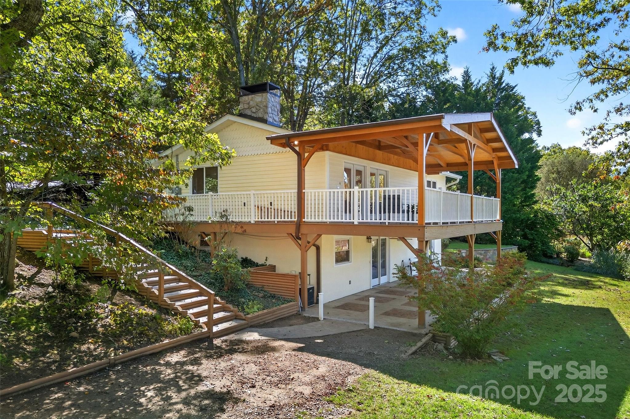 211 Rhododendron Avenue Black Mountain, NC 28711 - Photo 4 of 48 a view of house with a yard