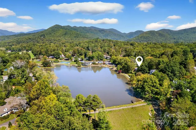 an aerial view of a house with a swimming pool
