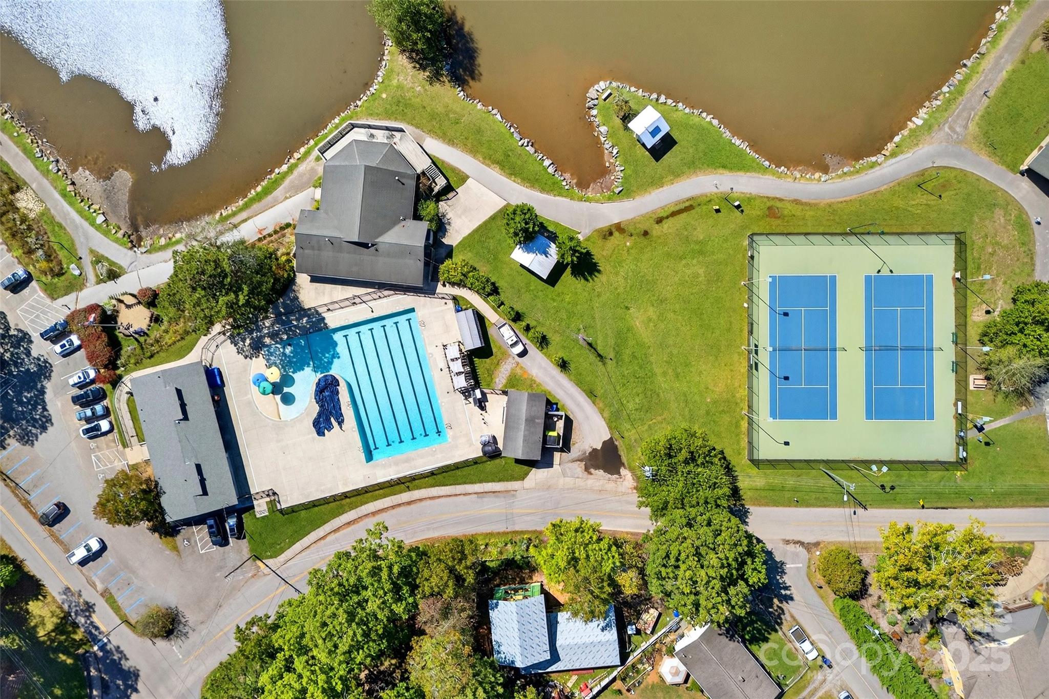 211 Rhododendron Avenue Black Mountain, NC 28711 - Photo 44 of 48 an aerial view of a house with a swimming pool