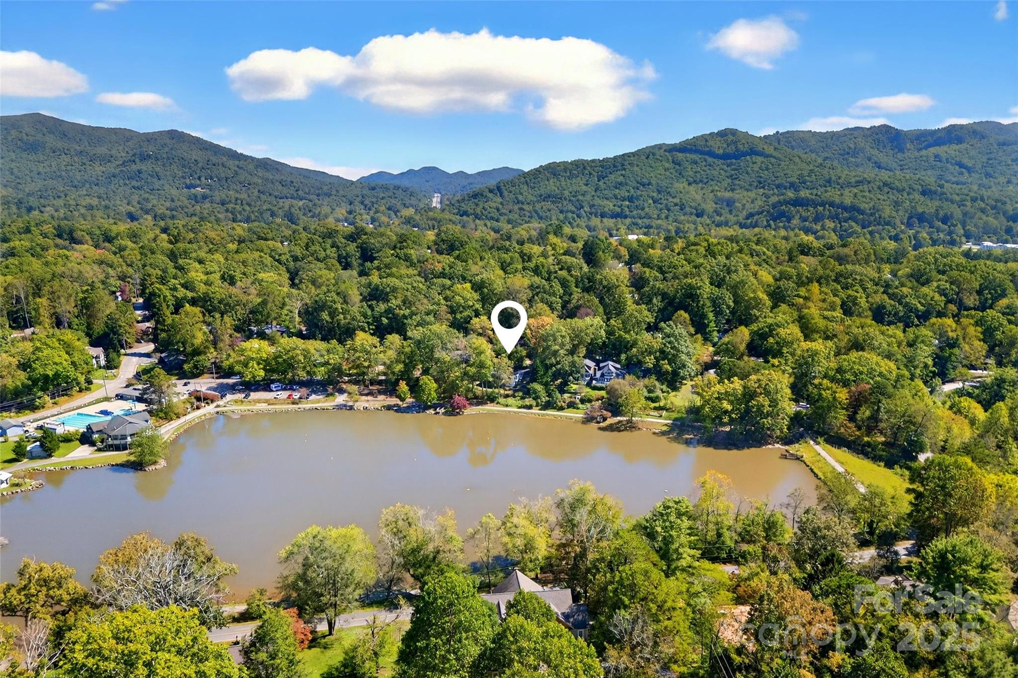 211 Rhododendron Avenue Black Mountain, NC 28711 - Photo 45 of 48 a view of a lake with mountains in the background