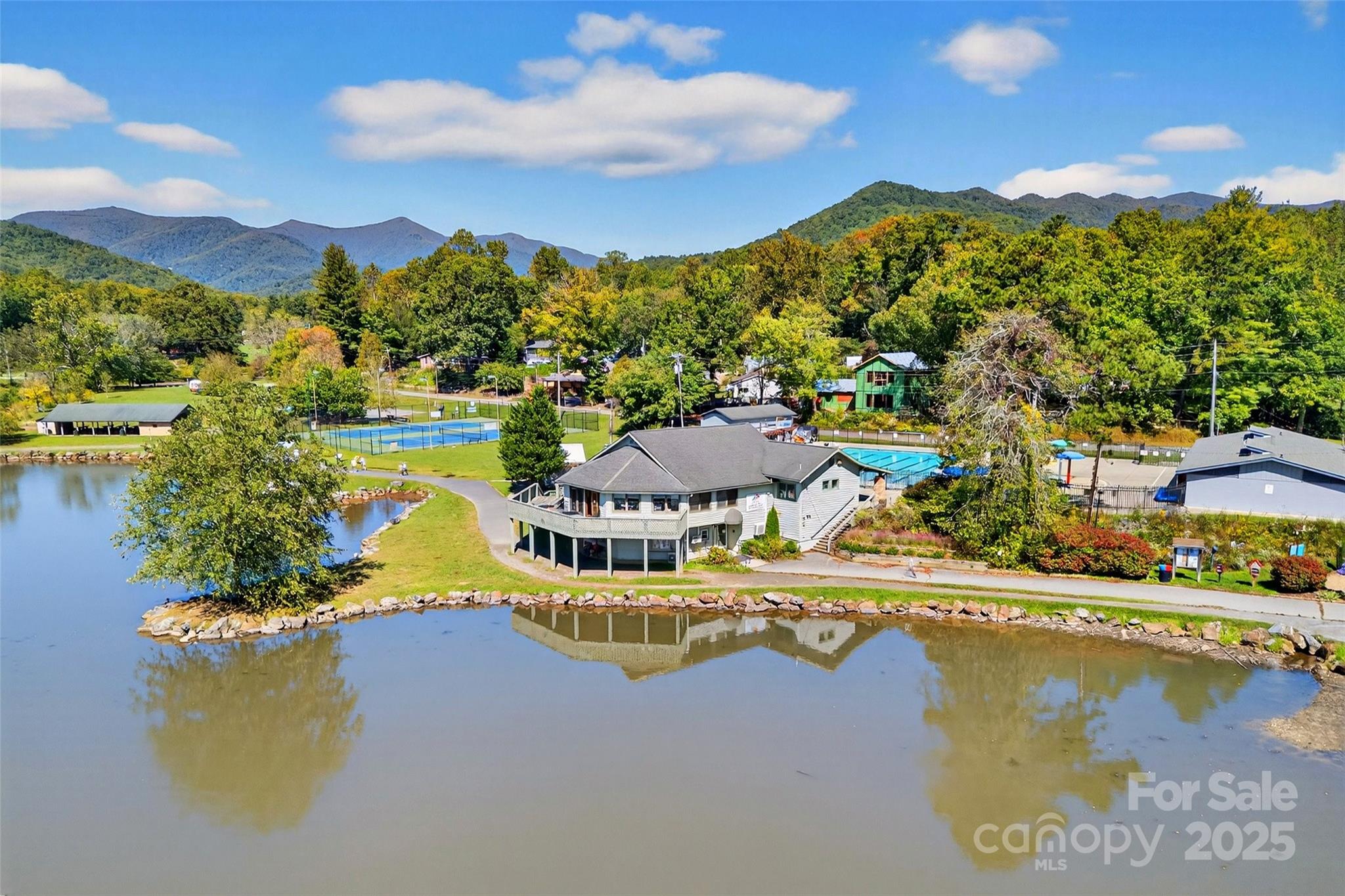 211 Rhododendron Avenue Black Mountain, NC 28711 - Photo 46 of 48 a view of a lake with a mountain