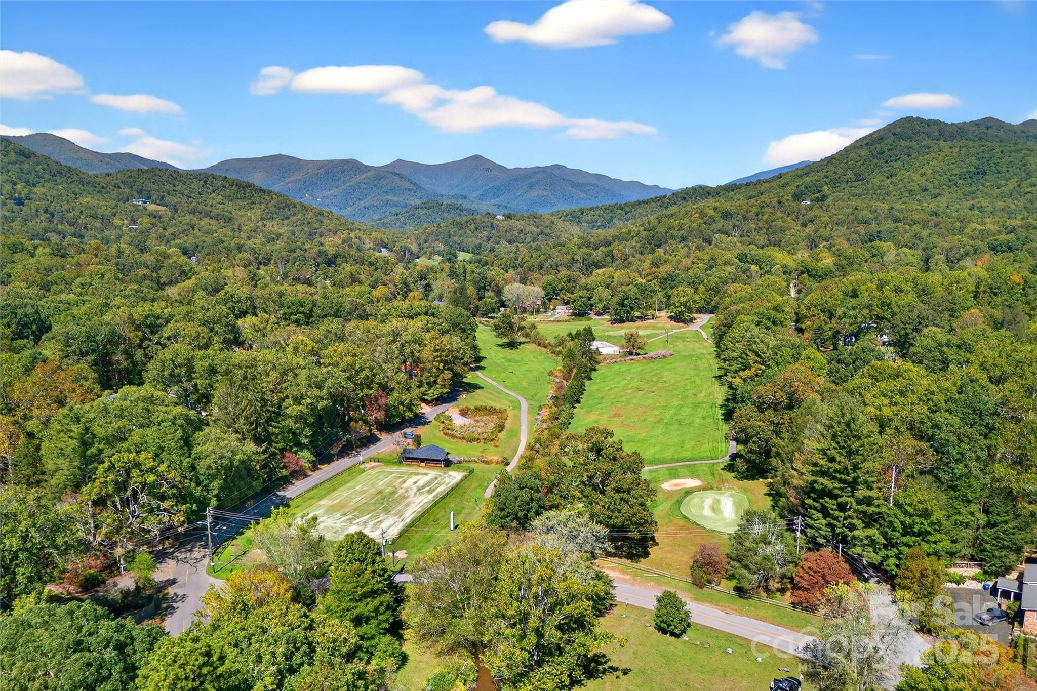 211 Rhododendron Avenue Black Mountain, NC 28711 - Photo 47 of 48 a view of a lake with mountains in the background