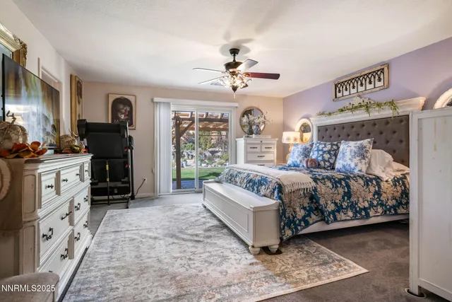 a bedroom with a bed next to a window with the outer view