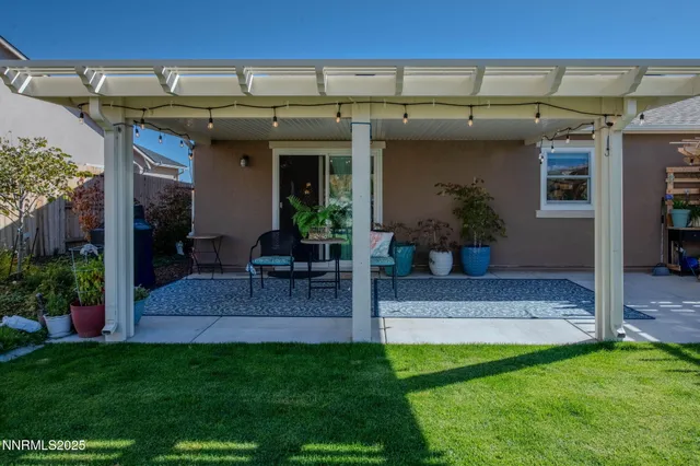 a view of an house with backyard porch and sitting area