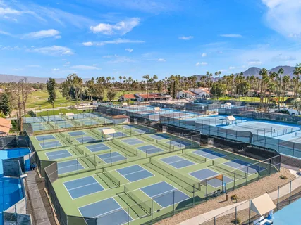 an aerial view of a house with outdoor space and lake view