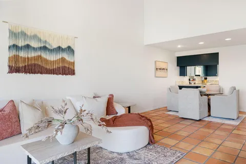 a living room with furniture and a rug
