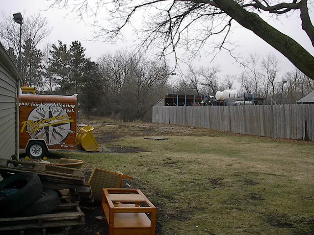 a view of a wooden fence with a bench