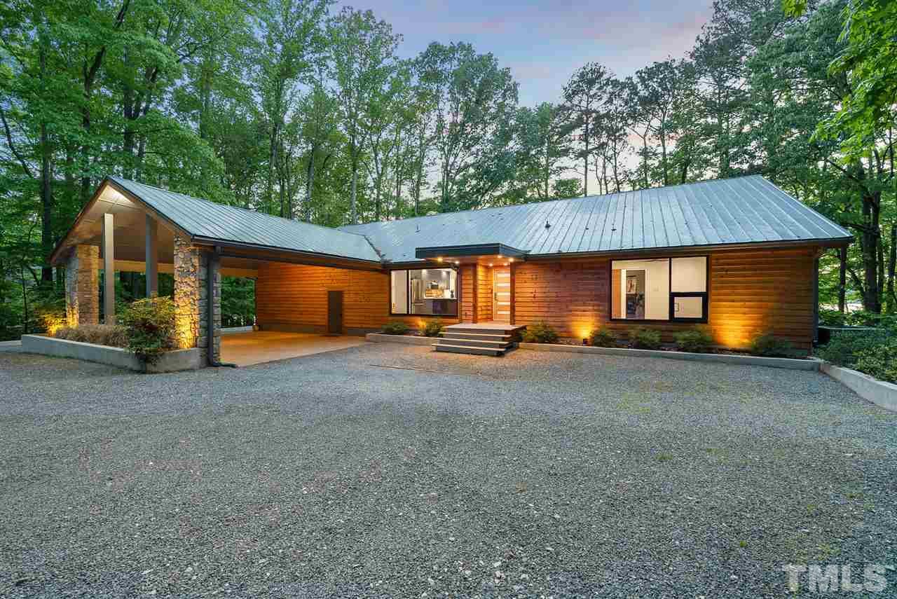6900 Denlee Road Raleigh, NC 27603 - Photo 1 of 30 a view of a house with a yard and large tree