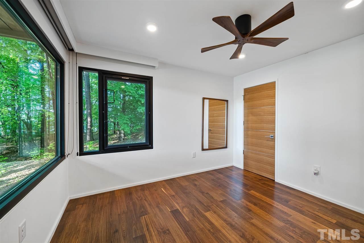 6900 Denlee Road Raleigh, NC 27603 - Photo 19 of 30 a view of a livingroom with a ceiling fan and a large window