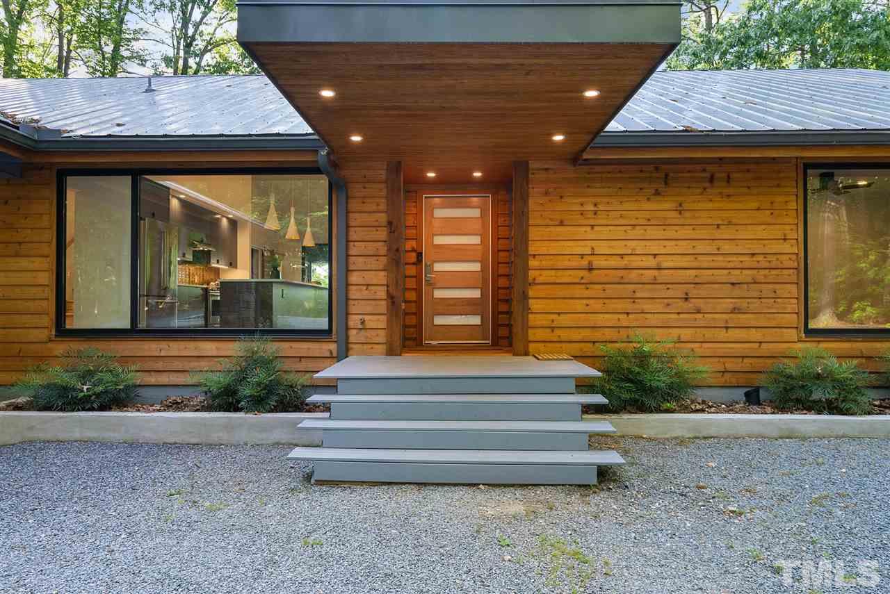 6900 Denlee Road Raleigh, NC 27603 - Photo 3 of 30 a front view of a house with plants