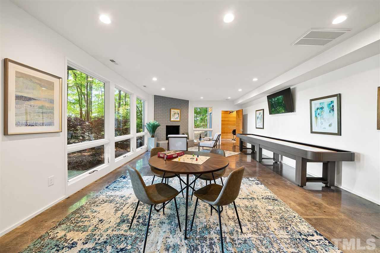 6900 Denlee Road Raleigh, NC 27603 - Photo 24 of 30 a view of a dining room with furniture window and wooden floor