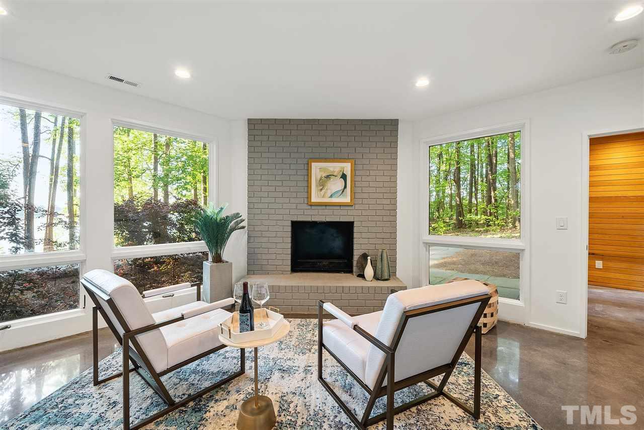 6900 Denlee Road Raleigh, NC 27603 - Photo 25 of 30 a living room with furniture and a fireplace