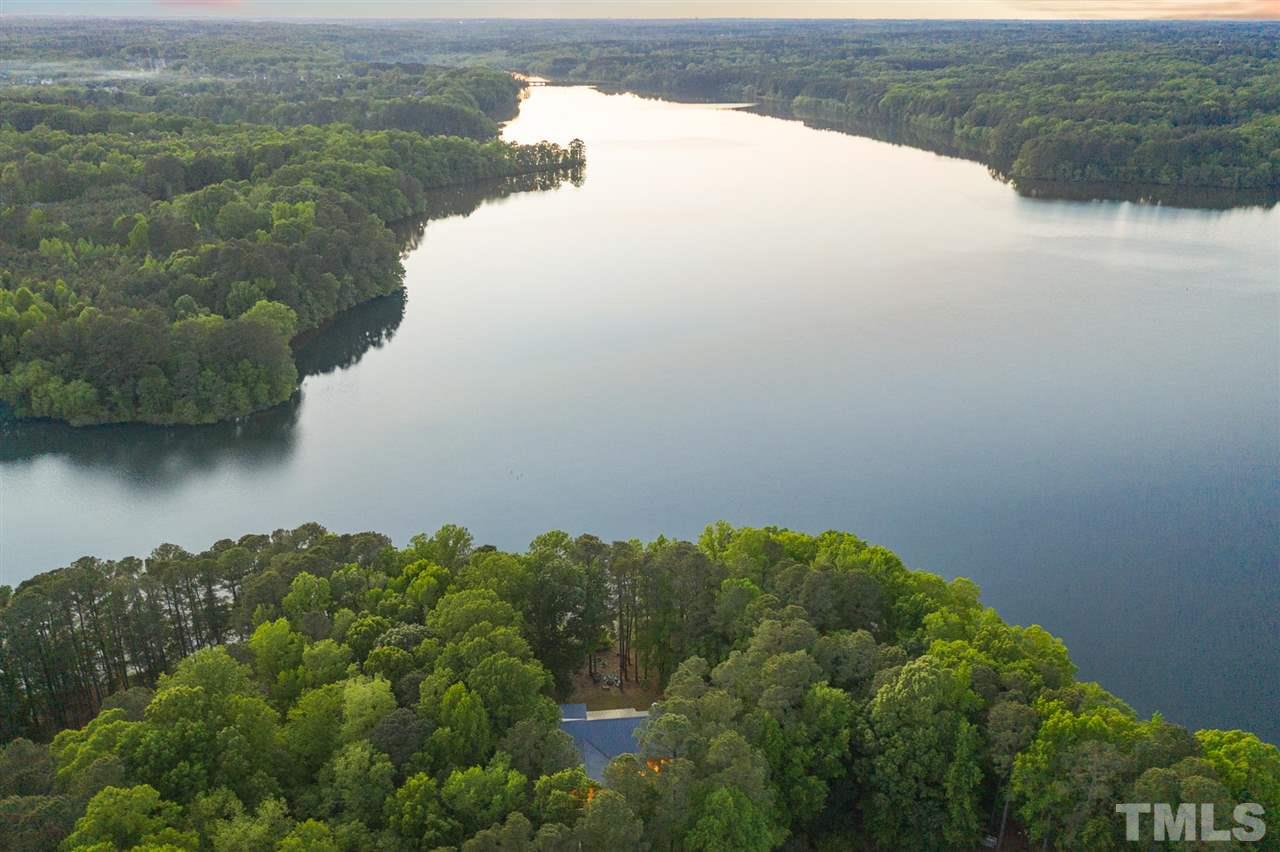 6900 Denlee Road Raleigh, NC 27603 - Photo 30 of 30 a view of a lake from a yard