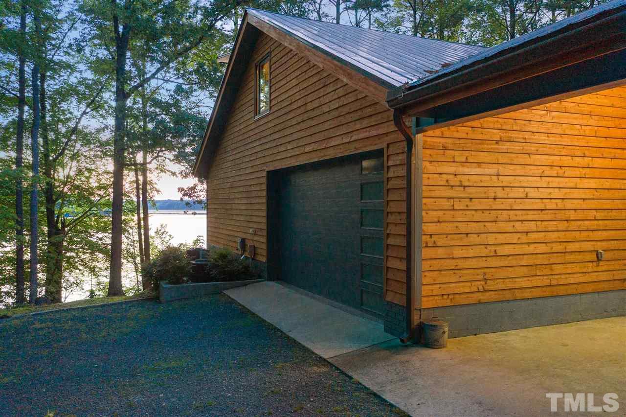 6900 Denlee Road Raleigh, NC 27603 - Photo 6 of 30 a view of a small house with a yard