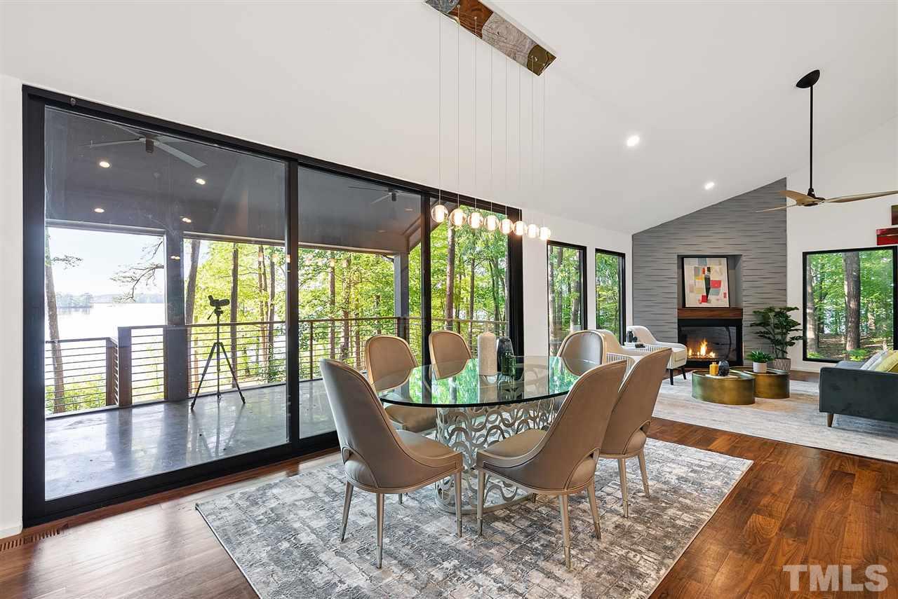 6900 Denlee Road Raleigh, NC 27603 - Photo 9 of 30 a view of a dining room with furniture window and wooden floor