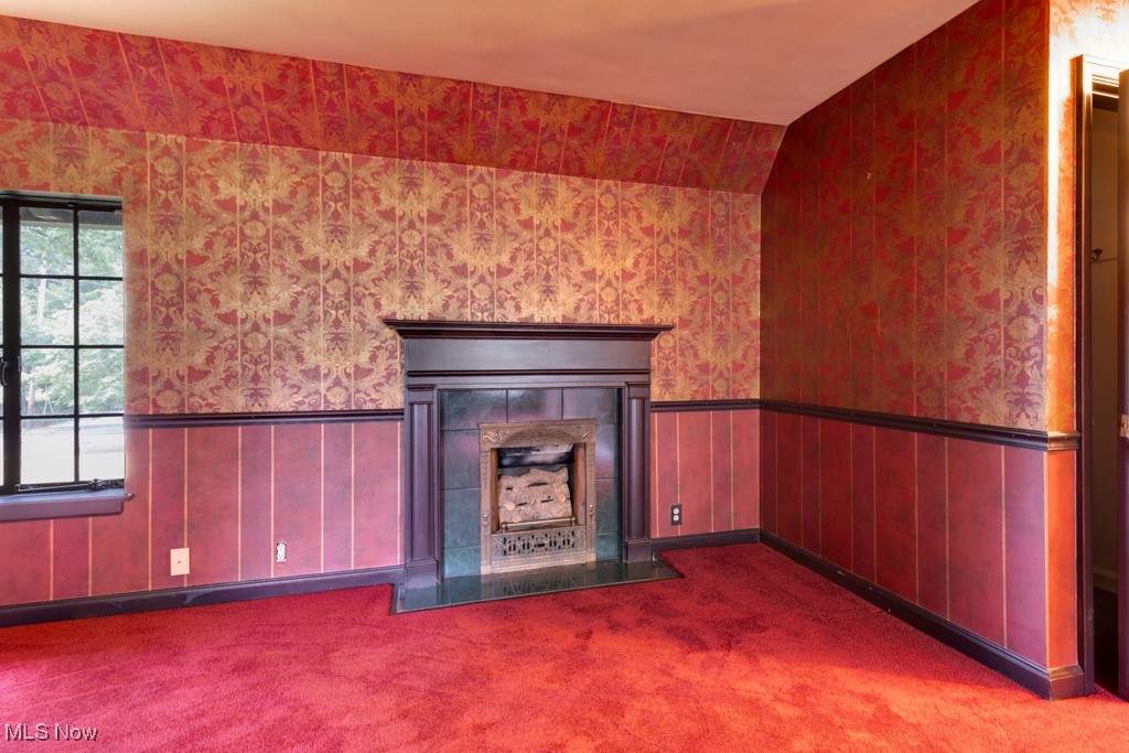 569 Merriman Road Akron, OH 44303 - Photo 41 of 43 Unfurnished living room with vaulted ceiling and carpet