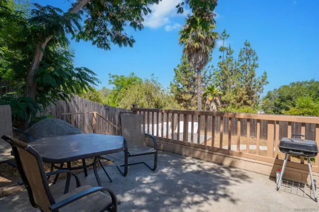 a view of a chair and table in the patio