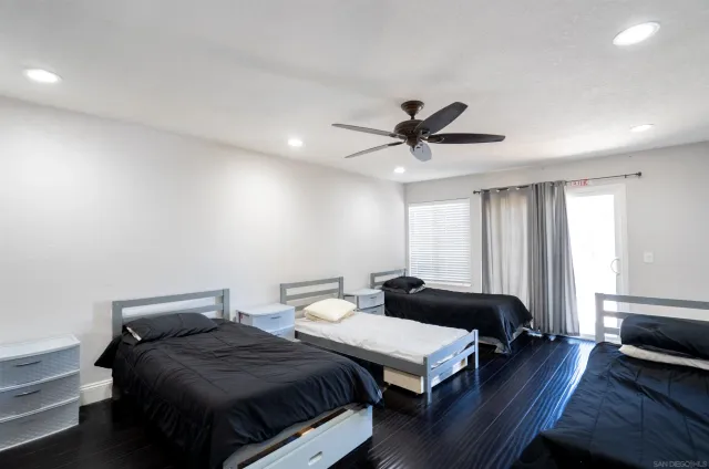 a bedroom with two beds and a couch